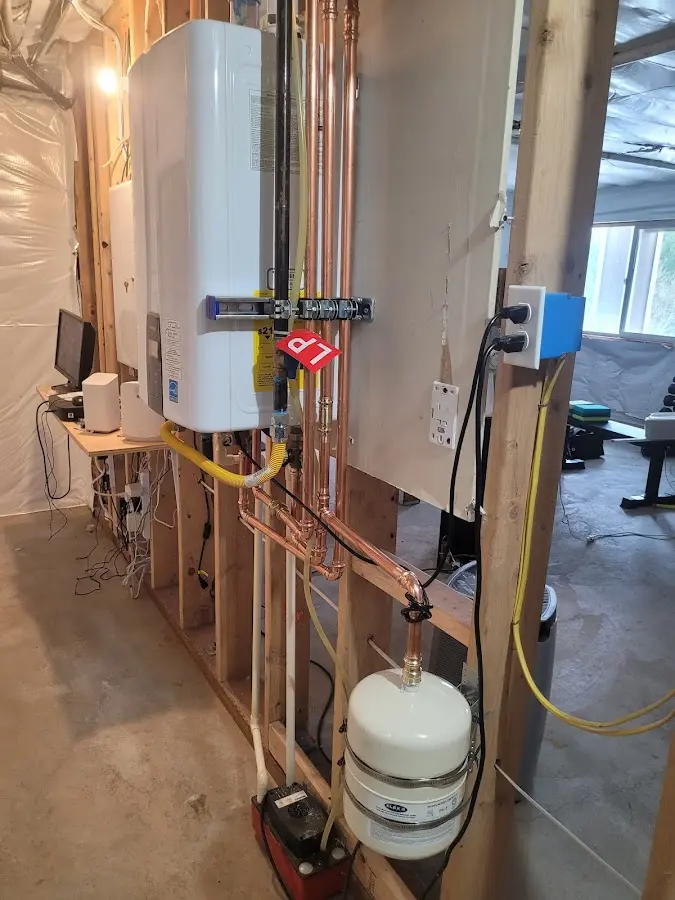 Licensed plumber repairing a kitchen sink in Opp